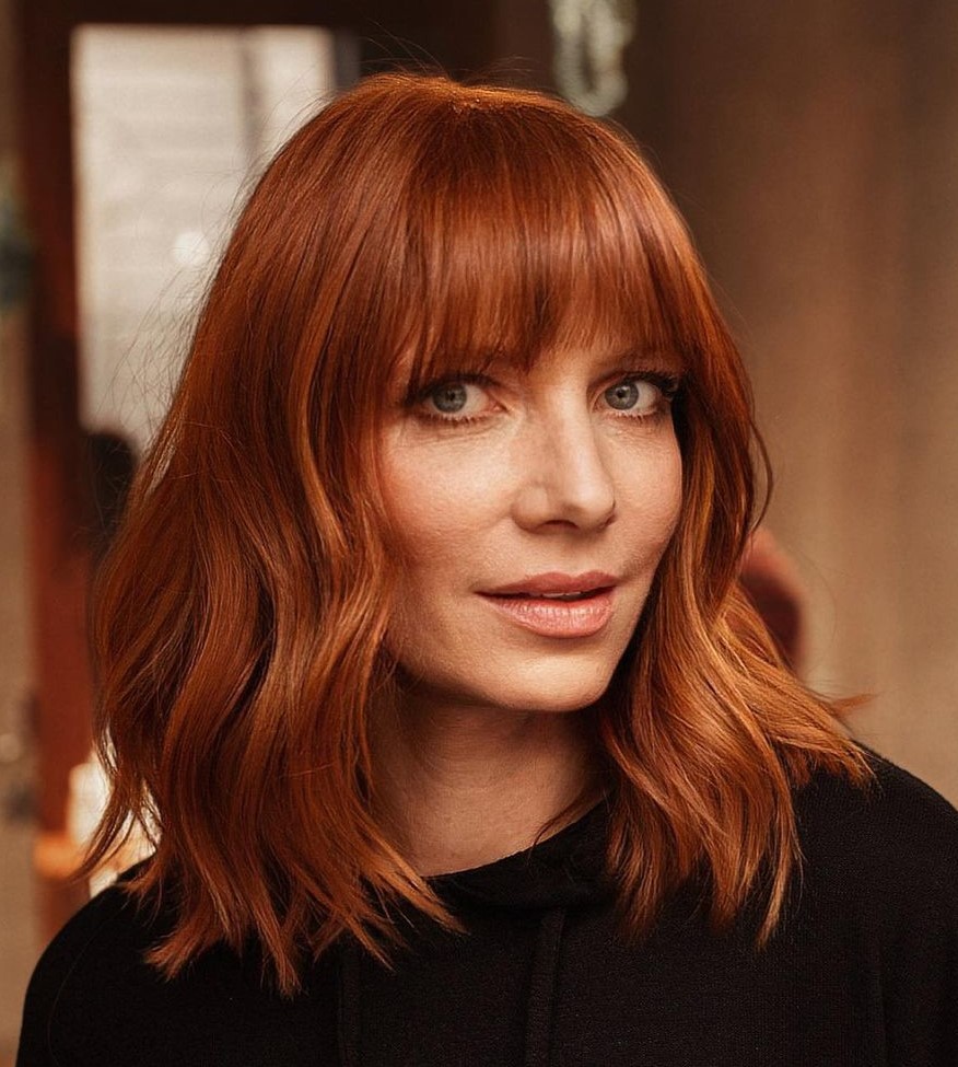 Bright Copper Hairstyle with Classy Bangs