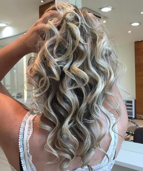 medium curly ash blonde hairstyle