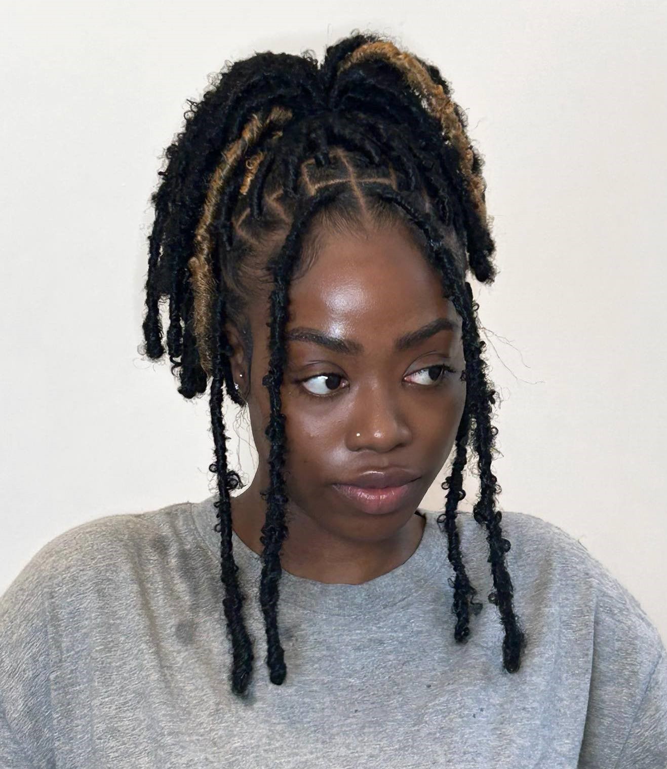 Locs in Pineapple Pony with Face Framing Locs
