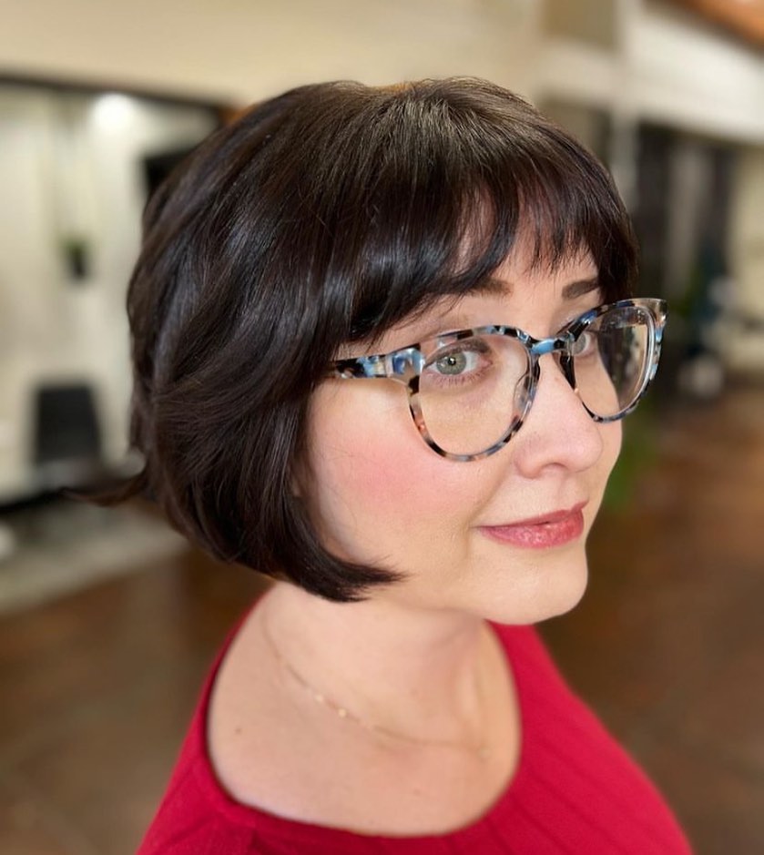 Soft Layered Bob with Bangs and Glasses